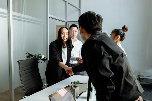 How can UK businesses implement lean management principles to reduce waste?